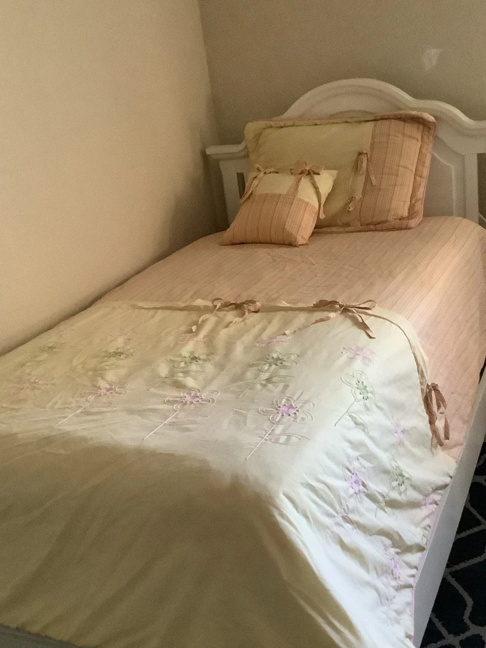 Cream Floral Embroidered Quilt with Peach Accents